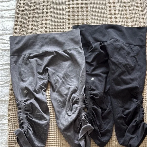 Two pair of Lululemon In The Flow- Cropped Gray and Black Leggings - Picture 3 of 4